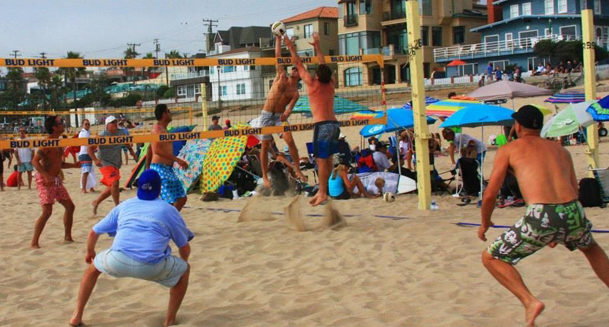 Jose Loiola, Joey Del Riego and Jim Arico watch teammate Hunter Hovland spike the ball past Aaron Wachtfogel while Dave Wagner and Chris Warshaw prepare to defend.