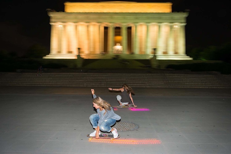 Cindy Whitehead skateboards past the Lincoln Memorial at night while in D.C. Photo by Ian Logan
