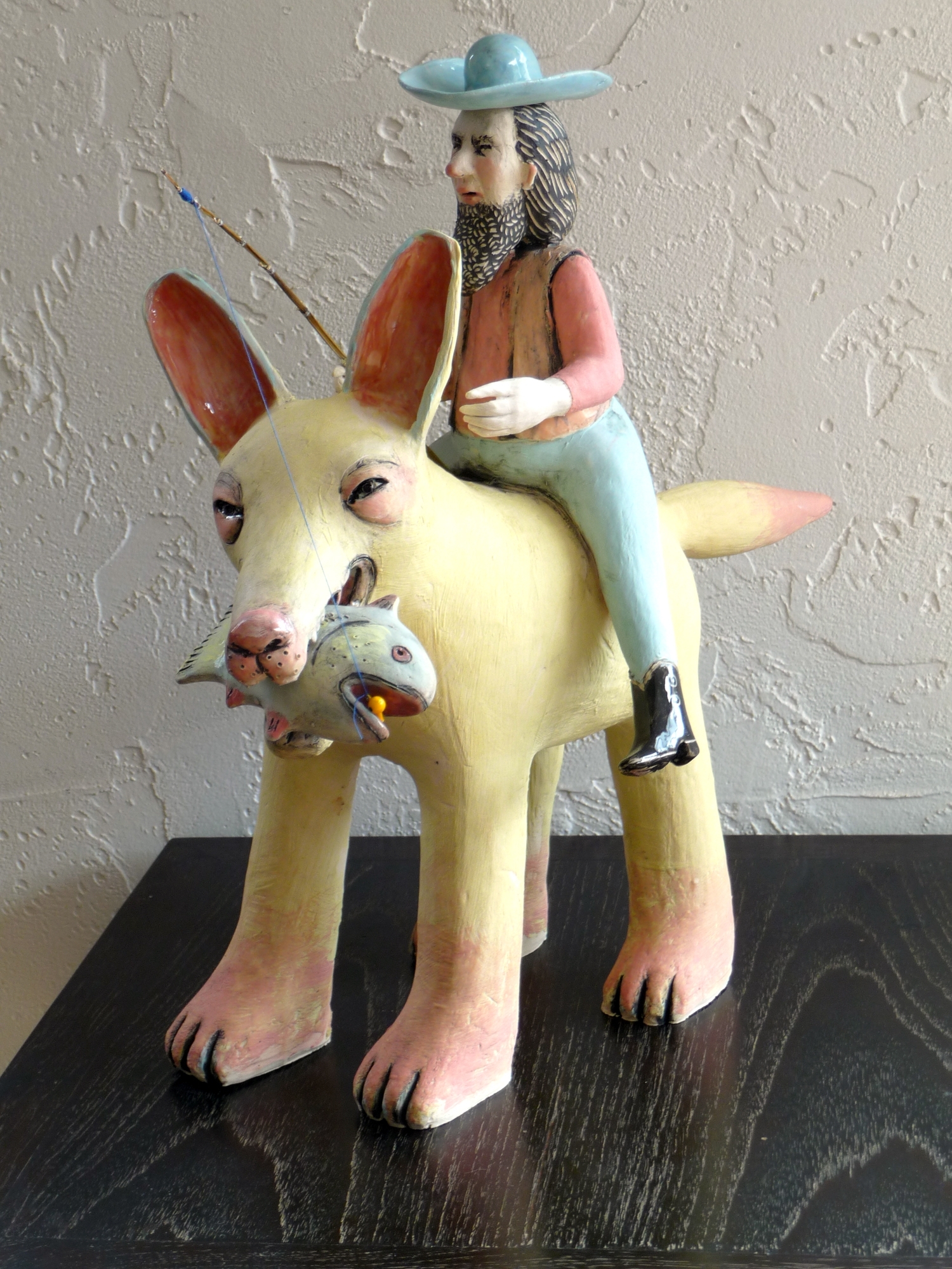 “Fisherman on a Dog,” ceramic by Lynn Haggard