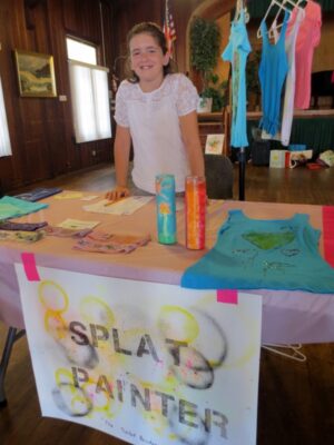 Ten-year-old Sheyla Jacobs shows off her creative shirts. Photo  