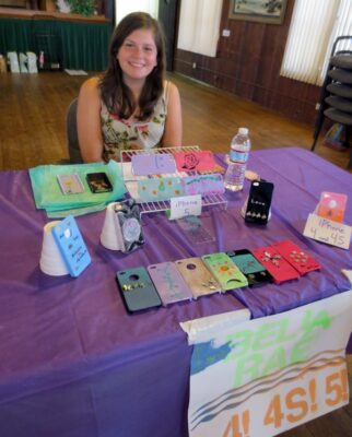 Isabella Fideler created painted iPhone cases for her display. Photo 