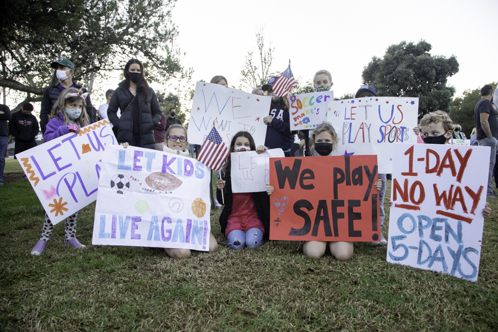 Students joined parents at the school reopening rally. Photo by JP Cordero