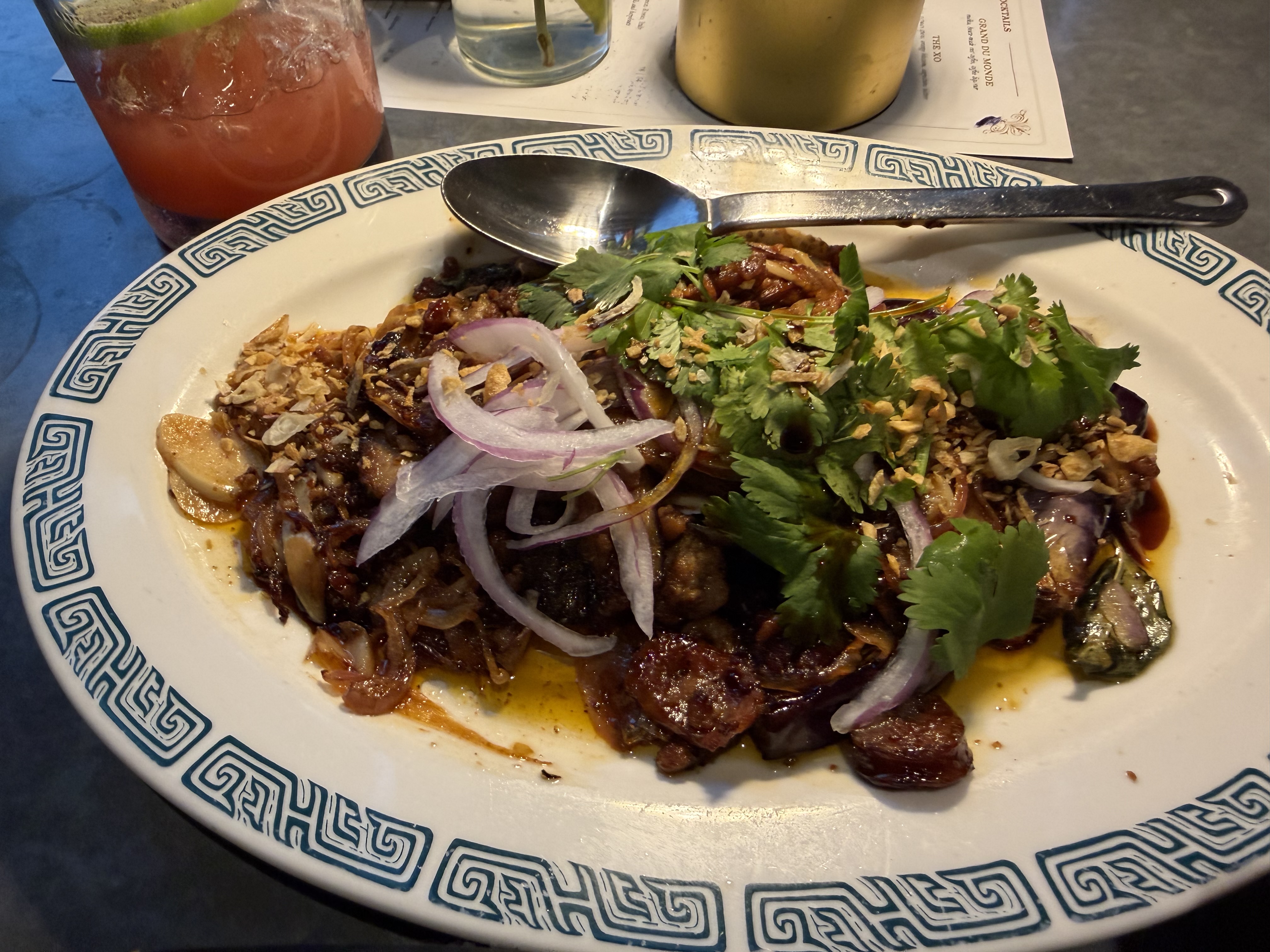 Fried eggplant is mixed with Chinese-srtyle mapo pork in a brown sauce. 