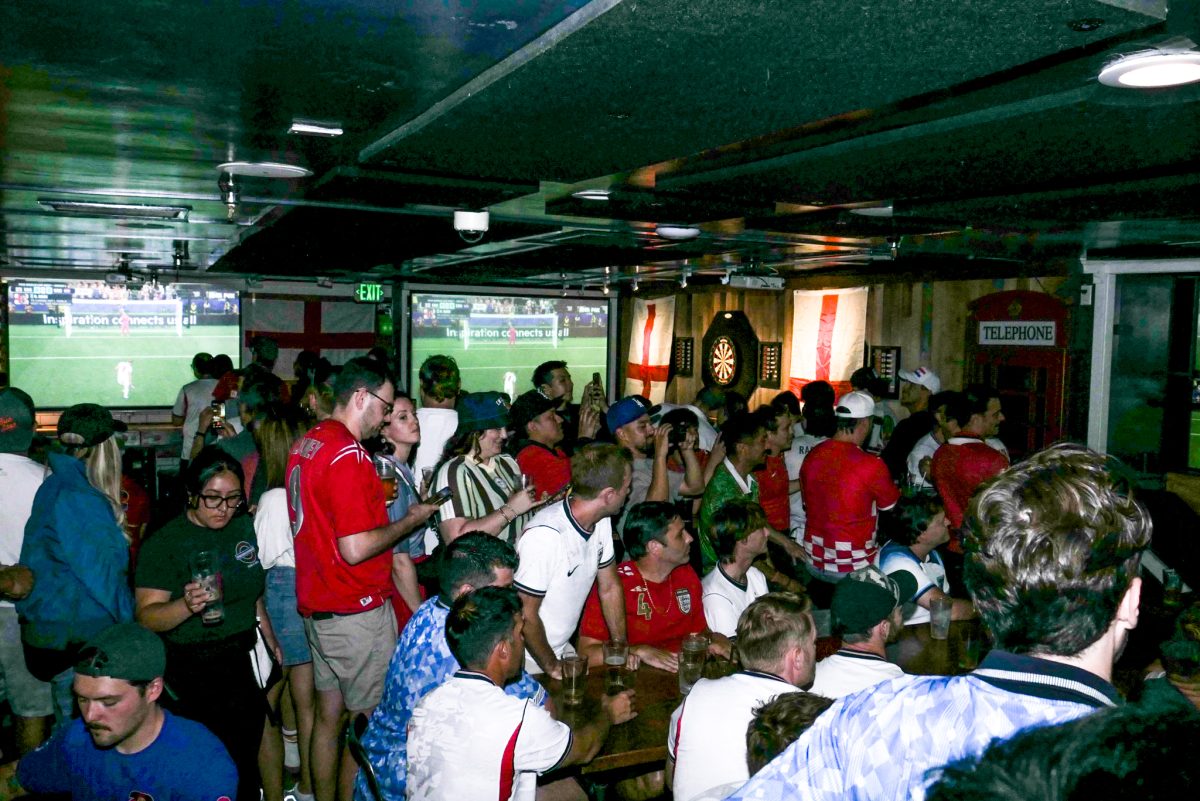 A large crowd Underground Pub watches World Cup soccer on multiple screens.